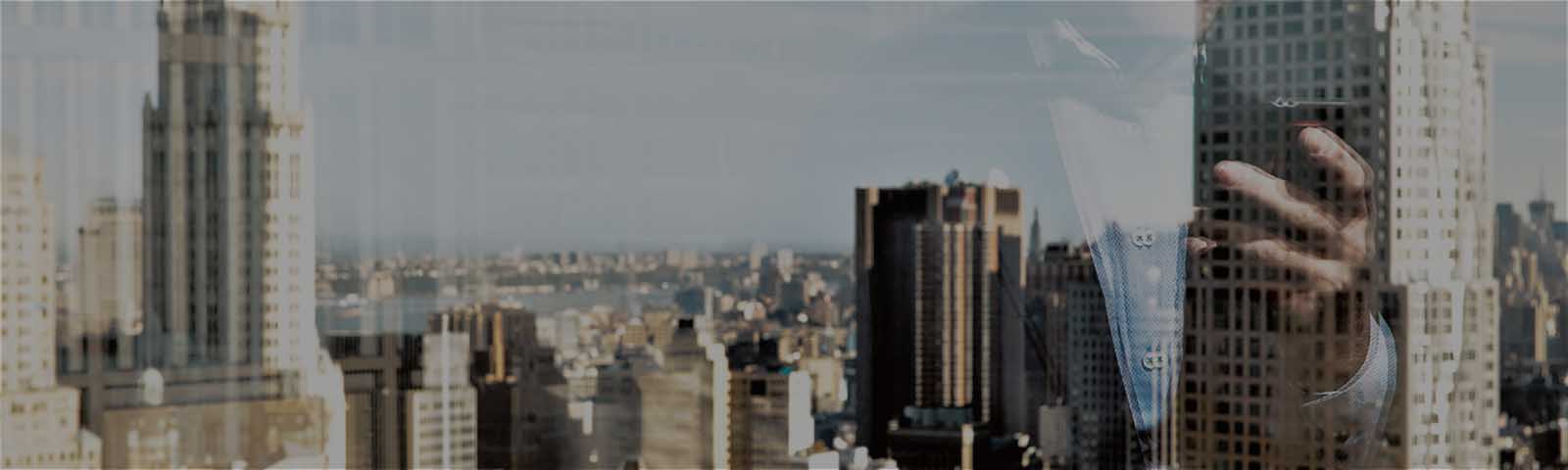 City skyline with man reflection in window