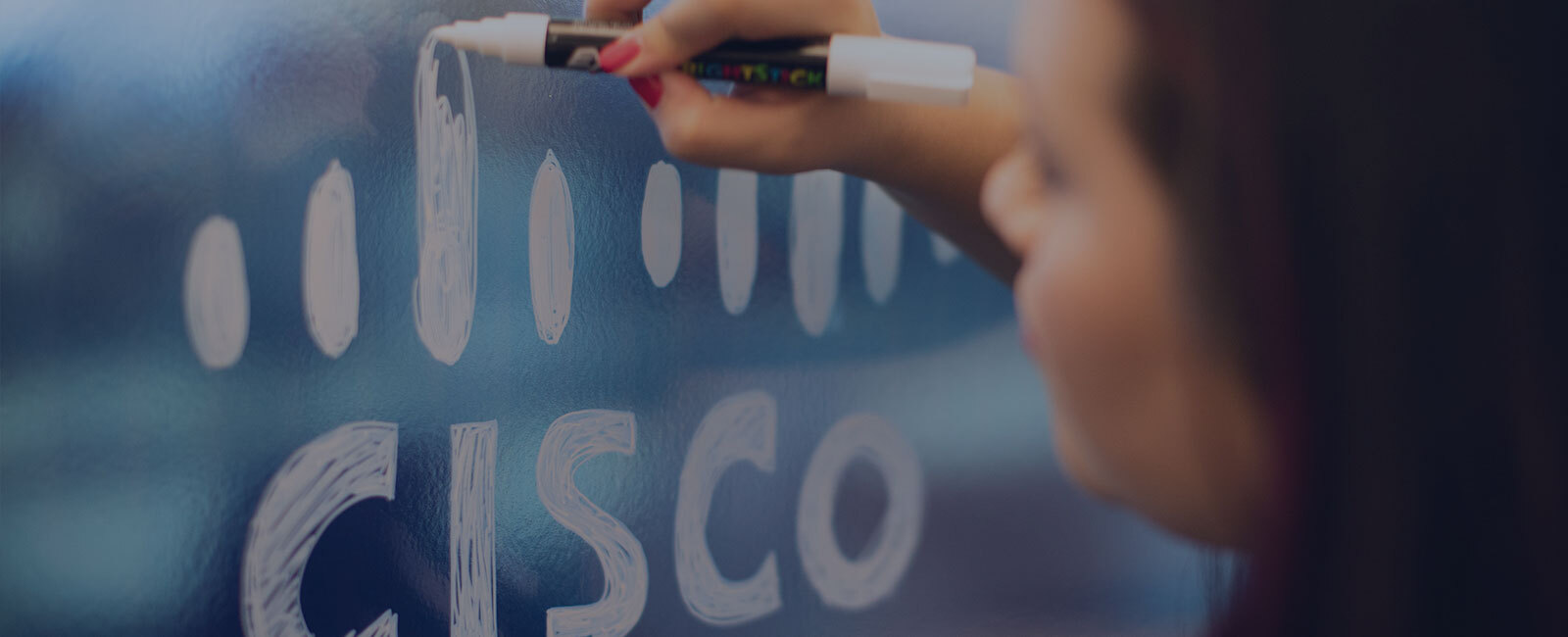 Female coloring in a White Cisco Logo on a glass office window