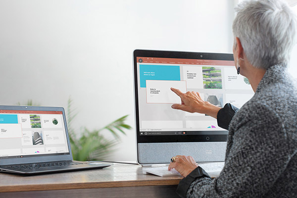 Person pointing to computer screen