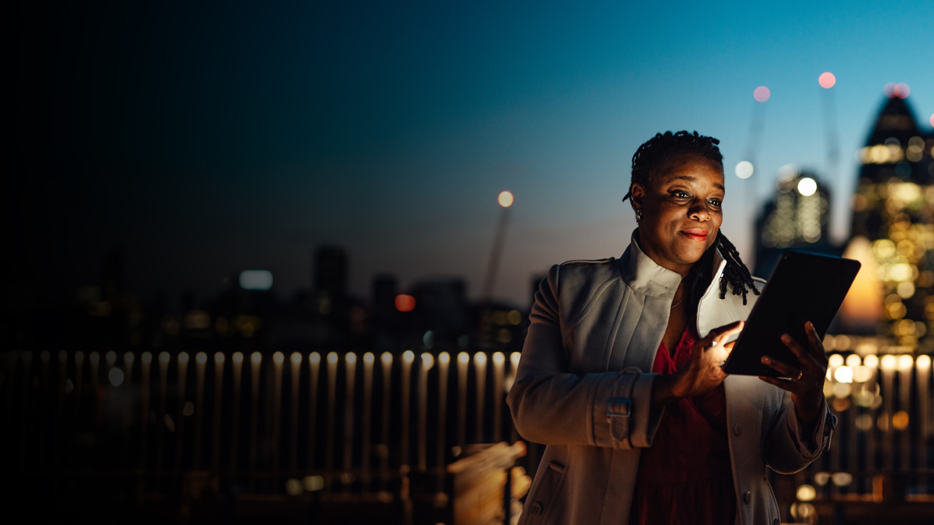 Woman with glasses looking at iPad